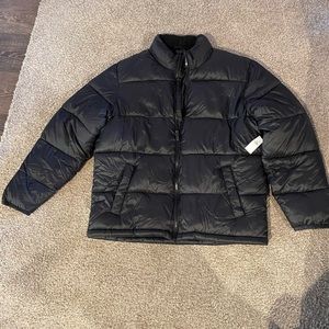 Mens black puffer jacket. Brand new with tags